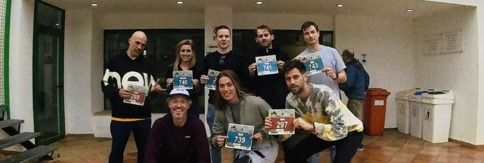 A group of runners collecting their race bibs for the Galatzó Trail 2024, preparing for the big race day.