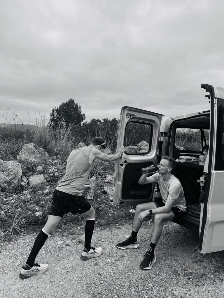 Tony and Max resting on the bus after completing a tough long run during the Running Mallorca Training Camp 2024.