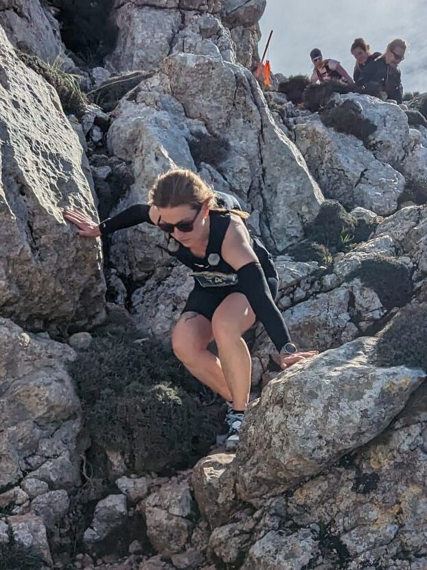 Marieke carefully navigating the steep and technical descent from Puig Galatzó during the Running Mallorca adventure.