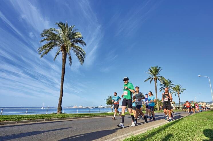 Runners racing through Palma coastal line during the TUI Palma Marathon.